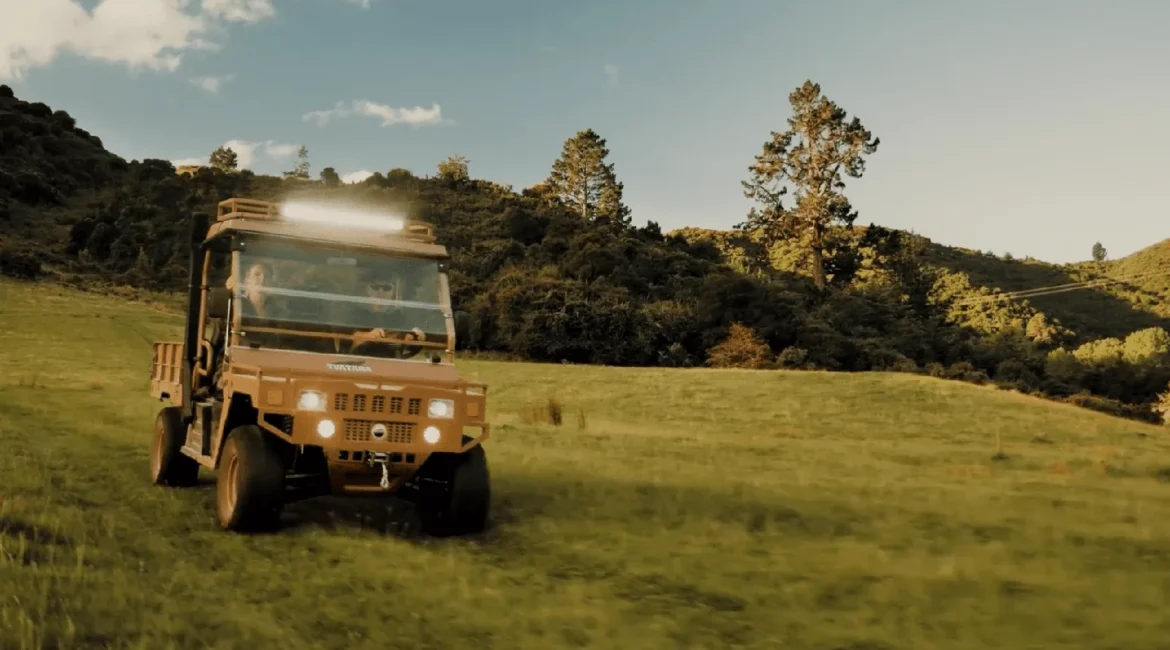 tuatara electric utv Tuatara electric UTV driving across farmland